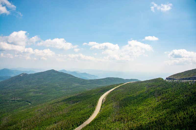 a-single-highway-swirls-through-a-hilly-landscape a-single-highway-swirls-through-a-hilly-landscape